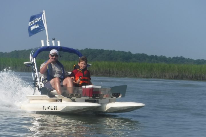 Man and boy on catamaran